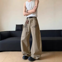 Reverse pocket design embroidered letter jeans with a curved silhouette, loose floor-length pants for women